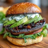 Hearty grilled portobello mushroom burgers making a perfect, satisfying vegetarian picnic option.