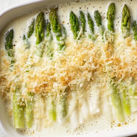 Freshly baked Asparagus Casserole bubbling with melted cheese and a crisp topping, ready to serve.